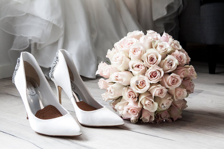 Pink bouquet and white shoes